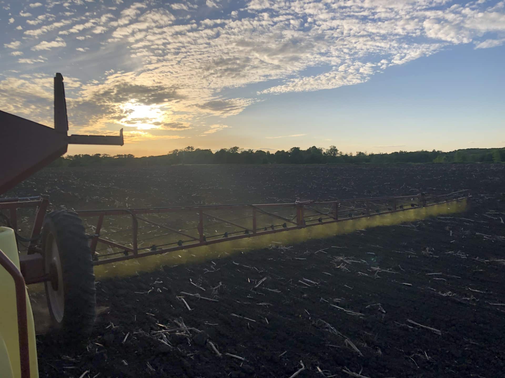 sprayer spraying in field